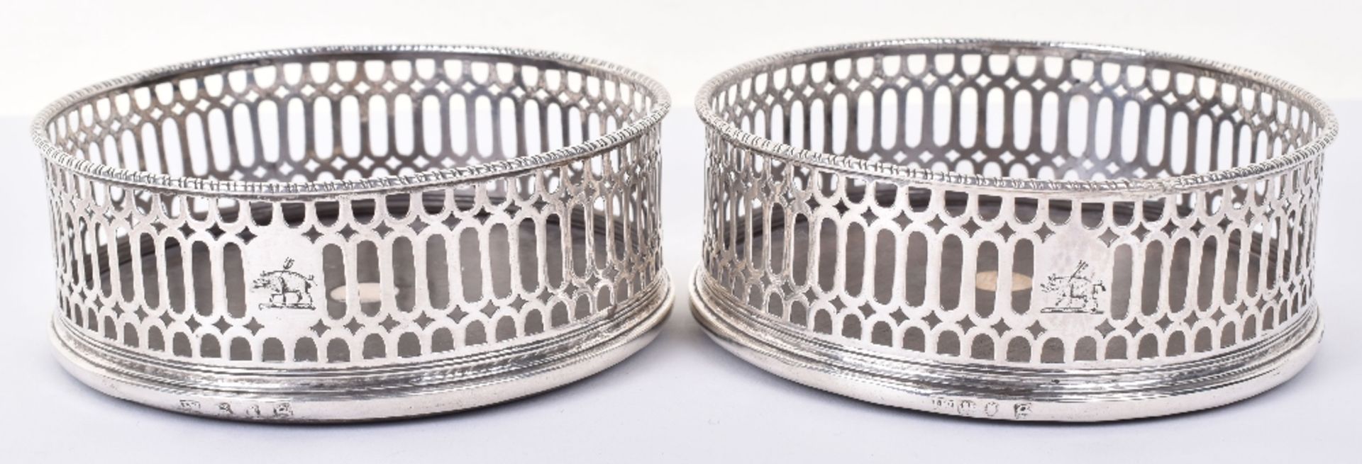 A pair of George III silver mounted coasters, by John Wittingham, London 1773