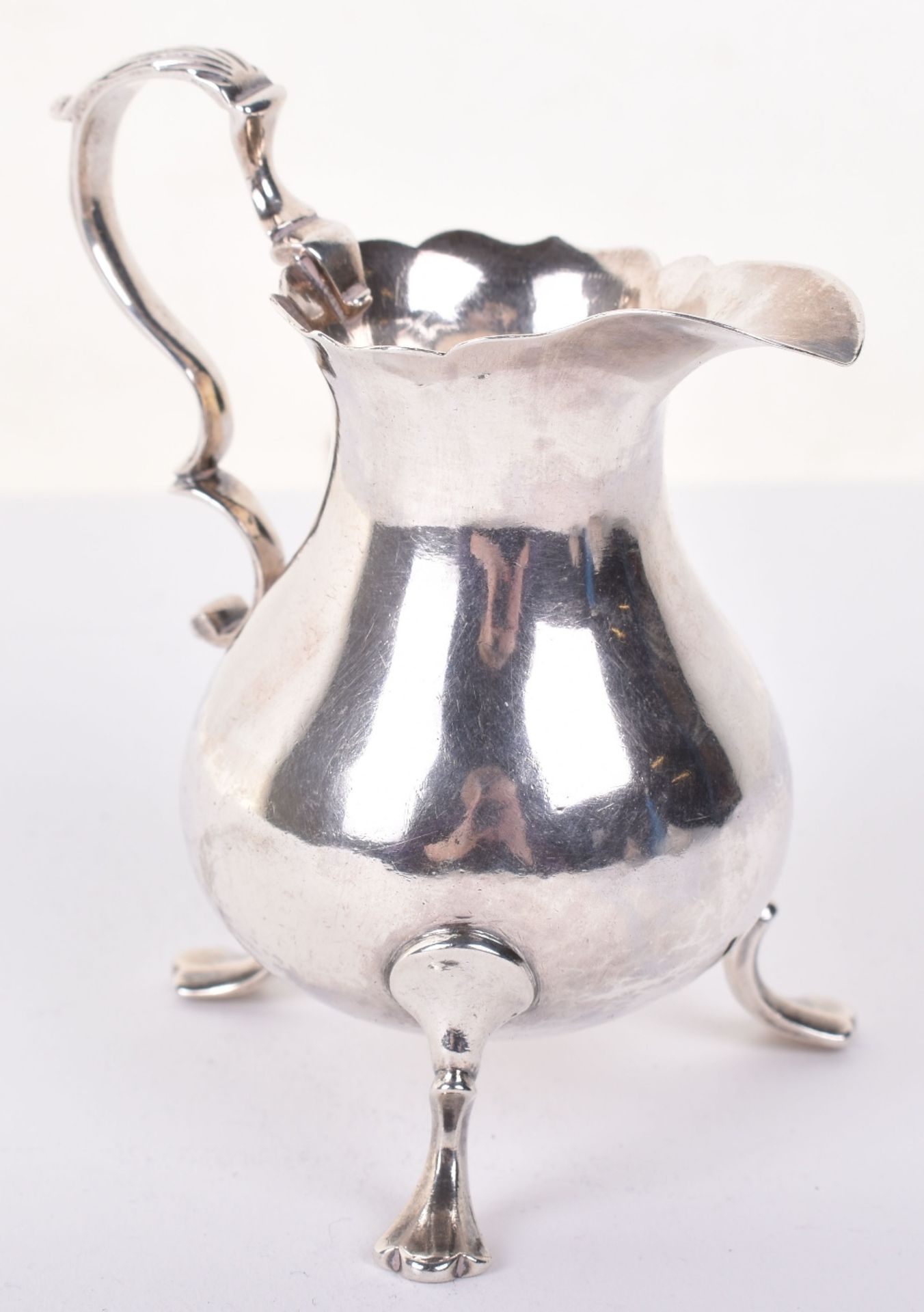 An early George III small silver cream jug, by William Brind, London 1760