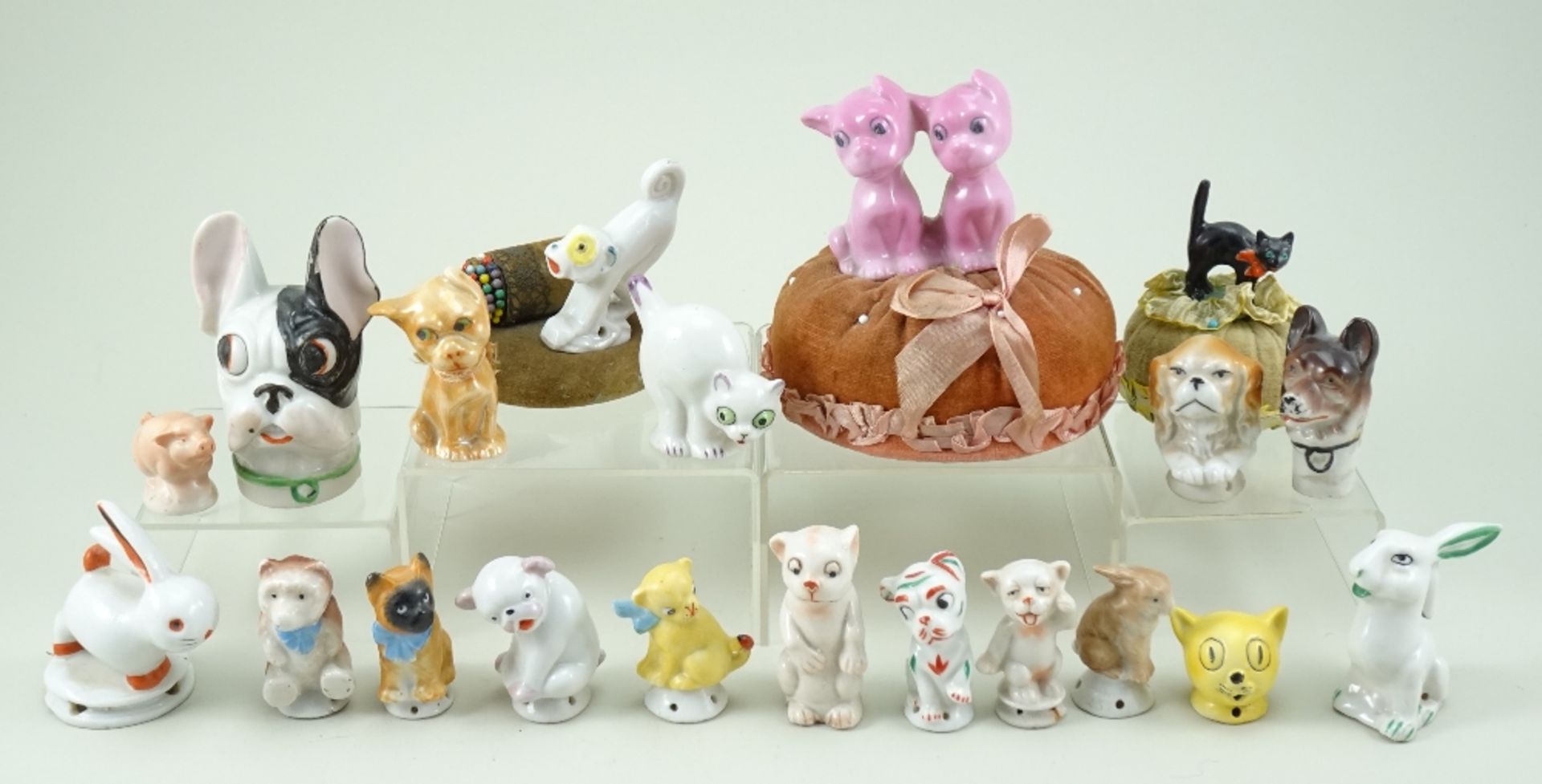 Collection of dog and animal pin-cushion figures,