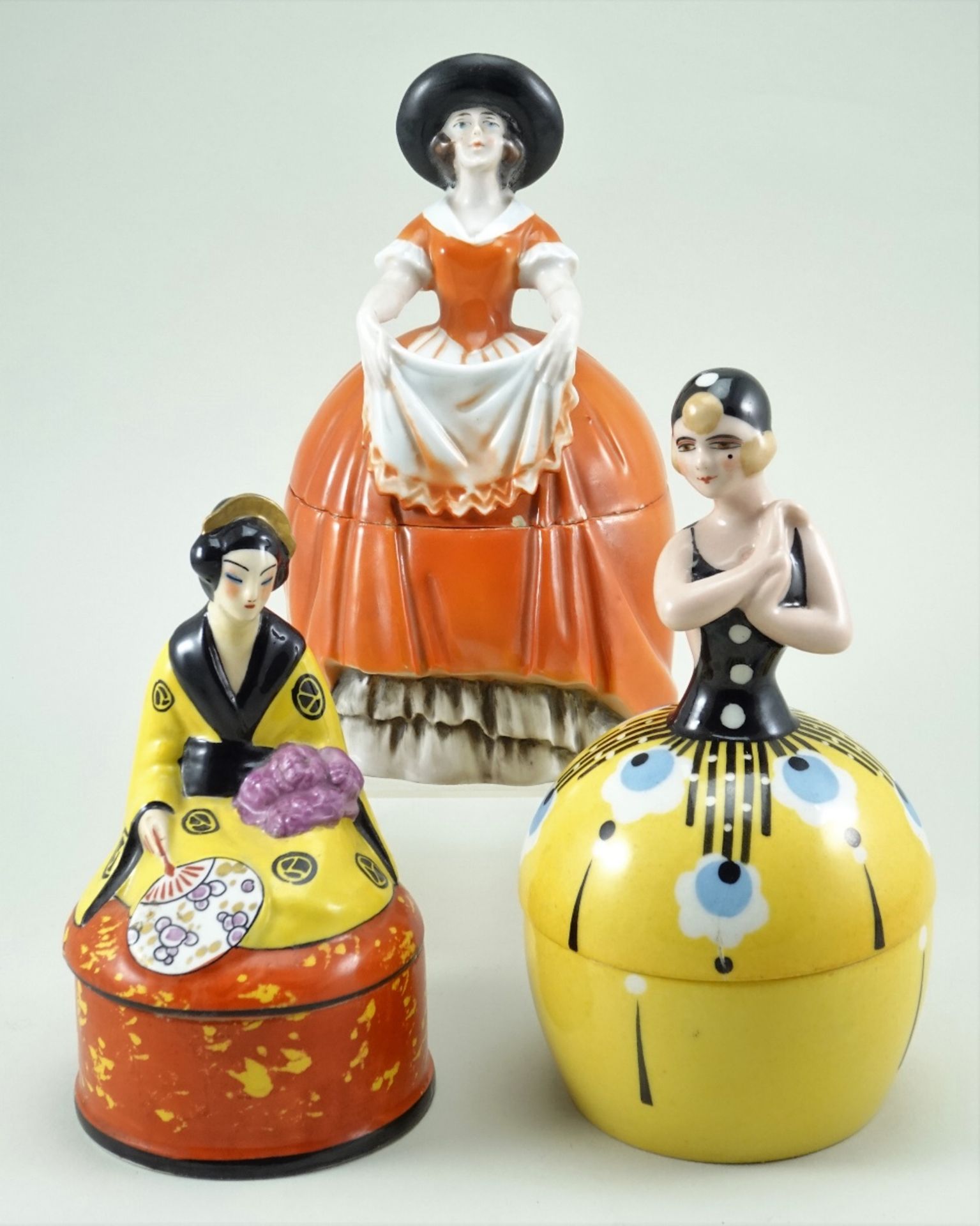 Three glazed china dressing table boxes, 1920s,