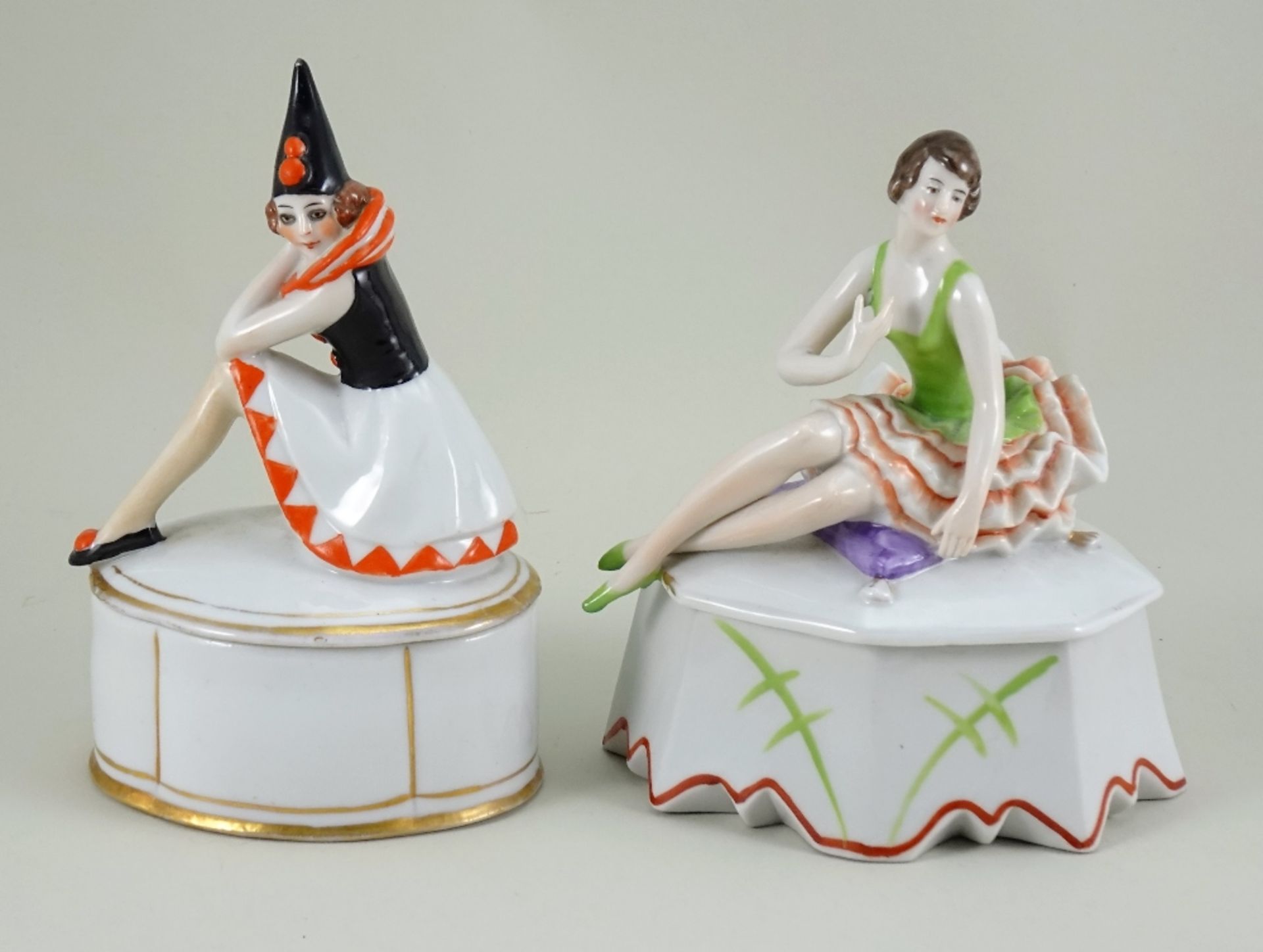 Two glazed china Deco Lady dressing table boxes, 1920s,