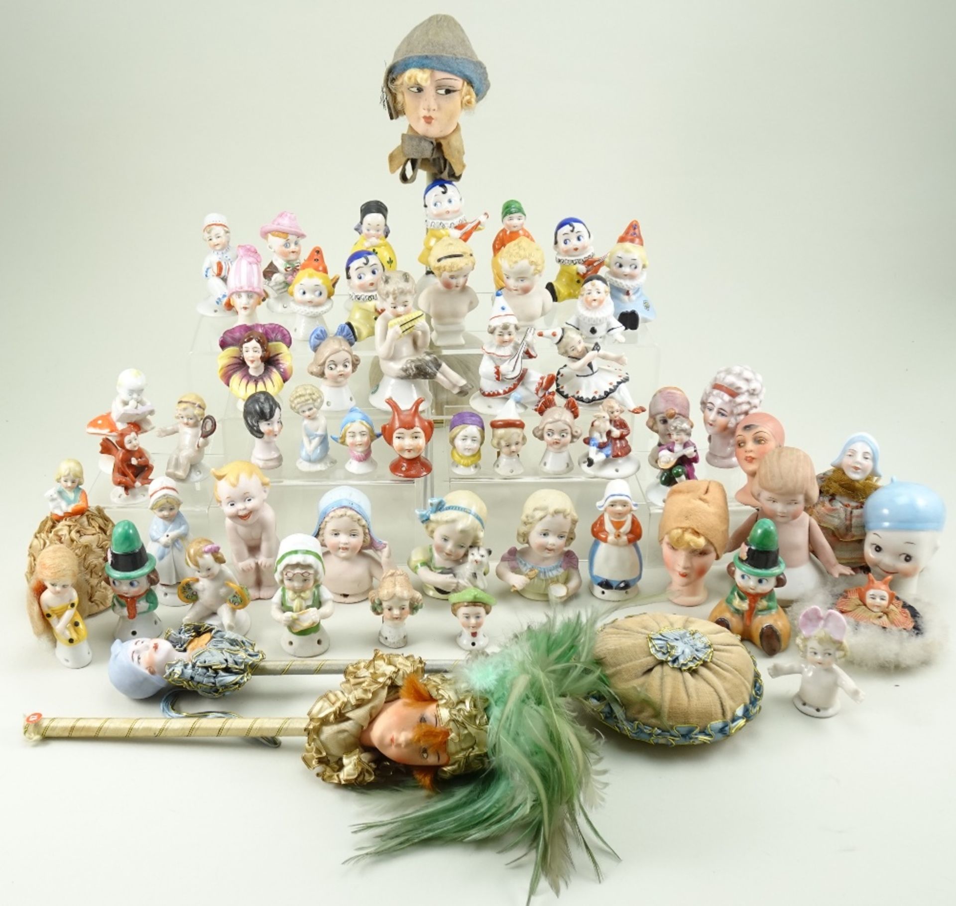 Collection of pin-cushion figures, 1920s/30s,