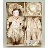 Rare size 3 Schmidt Bebe in presentation box with clothes and accessories, French circa 1880,