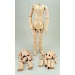 Three wood and composition dolls bodies,