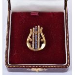 An unmarked gold, diamond and sapphire brooch