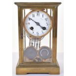 A late 19th century 8-day French made four glass brass mantle clock barometer