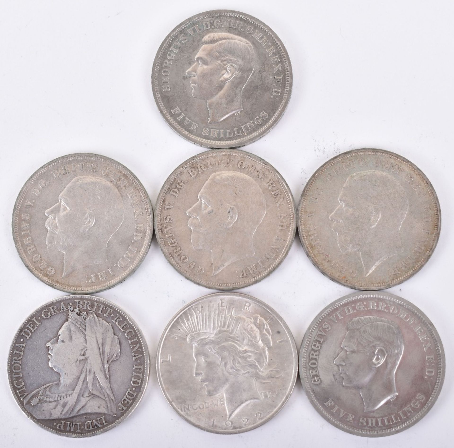 A Victoria 1900 Crown, three 1935 Crowns, 1922 Silver Dollar