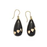 Pair of dangling earrings in yellow gold and tortoise