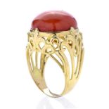 High ring in yellow gold and red coral paste