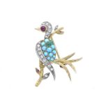 Parrot brooch in yellow gold, white gold, ruby, diamonds and turquoise