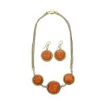 Necklace and earrings in yellow gold, diamonds and cameos in pink coral