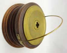 Copper and brass bowl of circular form with threaded stopper to the centre in later turned hardwood