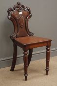 Victorian mahogany hall chair the pierced scrolling back carved with a stylised shell,