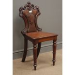 Victorian mahogany hall chair the pierced scrolling back carved with a stylised shell,