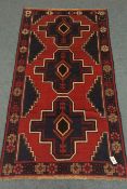 Old Baluchi red and blue ground rug,