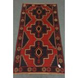 Old Baluchi red and blue ground rug,