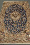 Persian Nain beige and blue ground rug, central medallion, interlaced floral field,