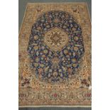 Persian Nain beige and blue ground rug, central medallion, interlaced floral field,