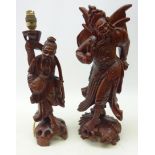 Chinese hardwood figure of a winged warrior carved from the solid with inset teeth H43cm and