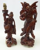 Chinese hardwood figure of a winged warrior carved from the solid with inset teeth H43cm and