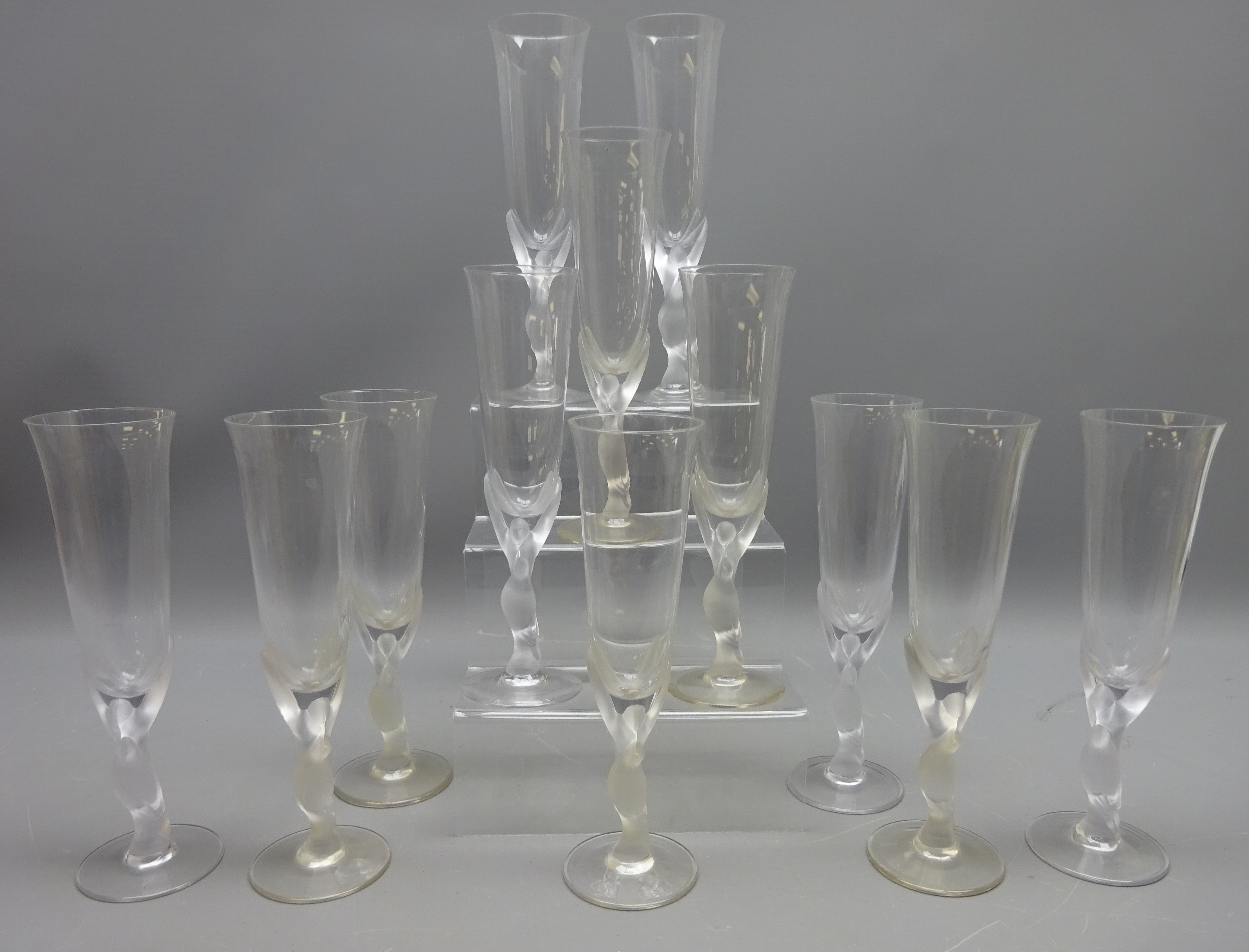 Set of twelve Igor Carl Faberge champagne flutes, the stem modelled as two kissing snow doves,