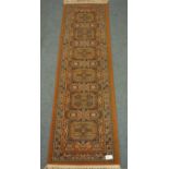 Persian red ground runner rug, six repeating medallions,