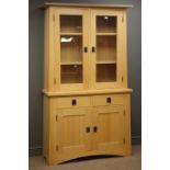 Beech bookcase and cupboard, projecting cornice,