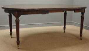 20th century Georgian style mahogany dining table with two leaves, turned tapering fluted supports,