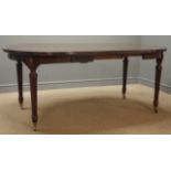 20th century Georgian style mahogany dining table with two leaves, turned tapering fluted supports,