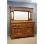 Edwardian walnut sideboard raised bevel edged mirror back, projecting cornice,