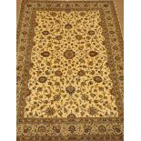 Large Persian Kashan ivory ground carpet, blue trailing foliage pattern, repeating border,