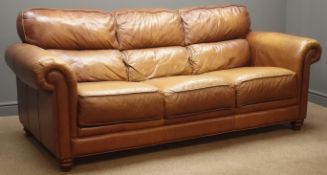 Traditional shaped three seat sofa upholstered in tan leather,