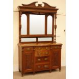 Edwardian walnut sideboard, shaped and carved pediment, two turned and fluted columns,