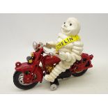Cast Michelin Man type figure on Motorcycle,