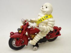 Cast Michelin Man type figure on Motorcycle,