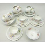 Eight Shelley 'Wild Flowers' pattern trios, three coffee cups and saucers, sugar bowl etc, No.