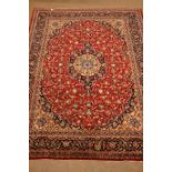 Persian Meshed red ground rug carpet, pointed medallion with rosette,