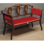 Edwardian inlaid mahogany two seat salon settee, upholstered in red fabric, shaped supports, W111cm,