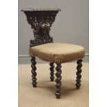 Late 19th century oak reading chair, carved with hound mask and foliage, barley twist supports,