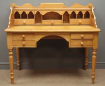 Polished pine kneehole desk, raised shaped back with pigeon holes and drawers, four drawers,