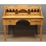 Polished pine kneehole desk, raised shaped back with pigeon holes and drawers, four drawers,