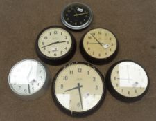 Four 'Smiths' circular bakelite slave clocks,