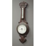 Early 20th century oak cased aneroid barometer, signed 'J. F.