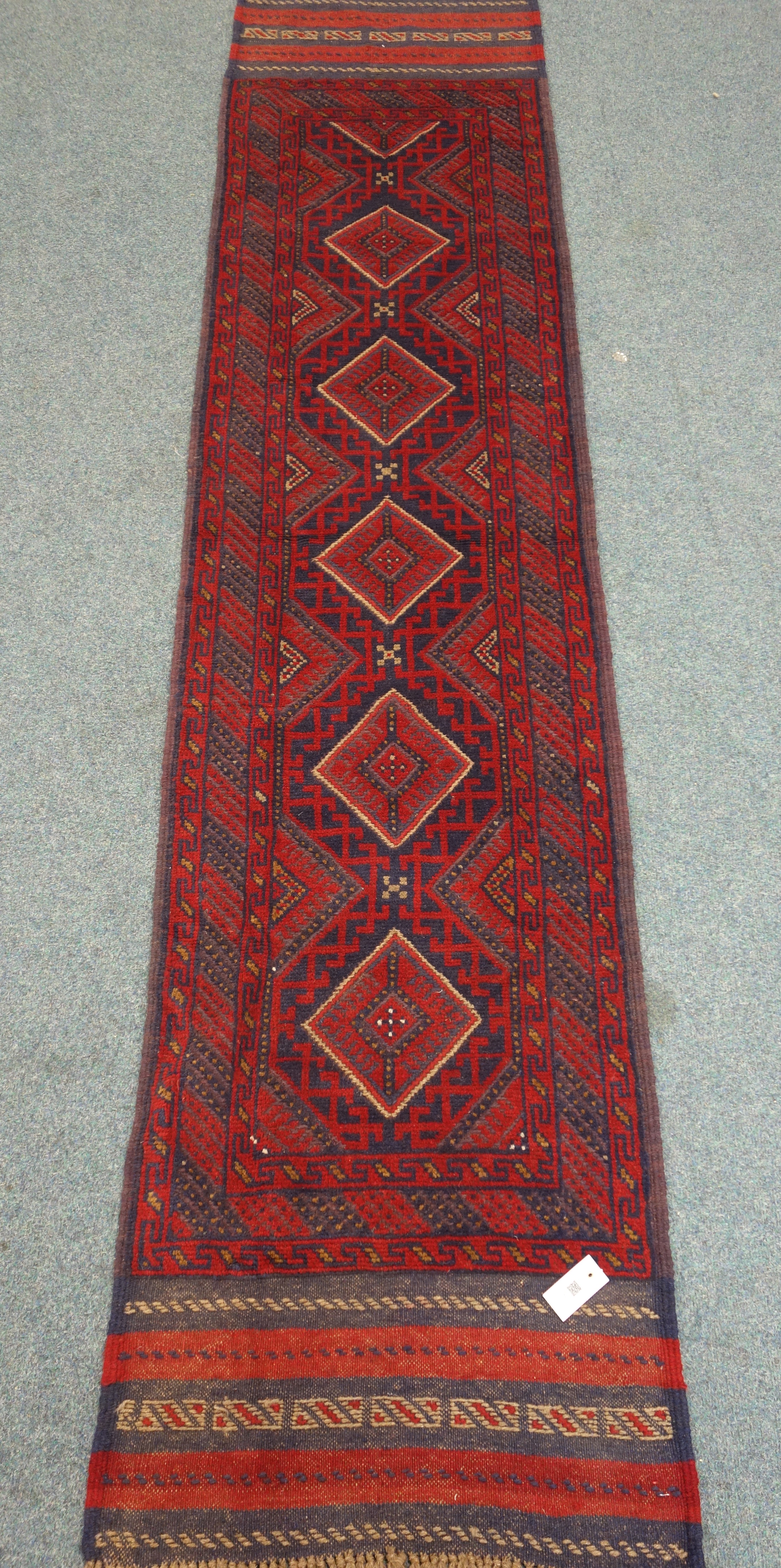 Meshwani red and blue ground runner rug,