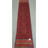 Meshwani red and blue ground runner rug,