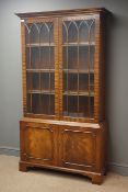 Reproduction mahogany display case, projecting cornice, two glazed doors enclosing three shelves,
