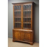 Reproduction mahogany display case, projecting cornice, two glazed doors enclosing three shelves,