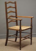 Early 20th century oak ladder back armchair, rush seat,