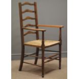 Early 20th century oak ladder back armchair, rush seat,