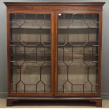 Large Georgian mahogany free standing bookcase, projecting cornice with dentil detail,